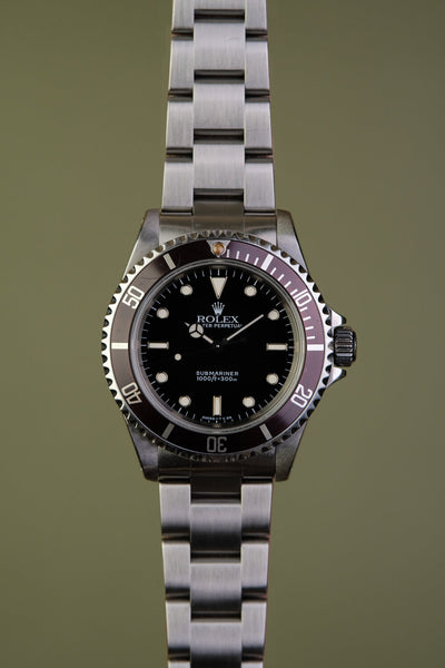 1997 Rolex 14060 Submariner with Tropical bezel