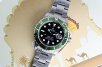2004 Rolex “kermit”  16610lv Anniversary Submariner - Box and Papers -