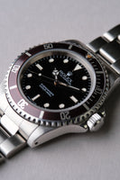 1997 Rolex 14060 Submariner with Tropical bezel