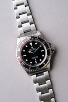 1997 Rolex 14060 Submariner with Tropical bezel
