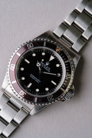 1997 Rolex 14060 Submariner with Tropical bezel