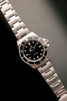 1997 Rolex 14060 Submariner - Box & Paper