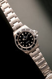 1997 Rolex 14060 Submariner - Box & Paper
