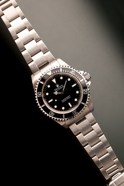 1997 Rolex 14060 Submariner - Box & Paper
