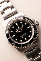 1997 Rolex 14060 Submariner - Box & Paper