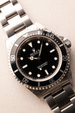 1997 Rolex 14060 Submariner - Box & Paper