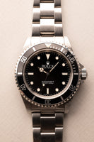 1997 Rolex 14060 Submariner - Box & Paper
