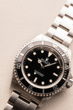 1997 Rolex 14060 Submariner - Box & Paper
