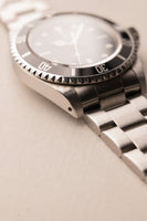 1997 Rolex 14060 Submariner - Box & Paper
