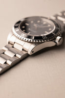 1997 Rolex 14060 Submariner - Box & Paper