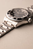 1997 Rolex 14060 Submariner - Box & Paper