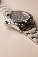 1997 Rolex 14060 Submariner - Box & Paper