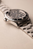 1997 Rolex 14060 Submariner - Box & Paper