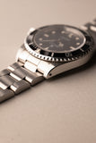 1997 Rolex 14060 Submariner - Box & Paper