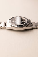 1997 Rolex 14060 Submariner - Box & Paper