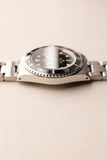 1997 Rolex 14060 Submariner - Box & Paper