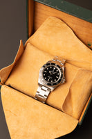 1997 Rolex 14060 Submariner - Box & Paper