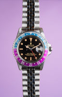 1965 Rolex Gilt 1675 GMT with Fuchsia turning Tropical