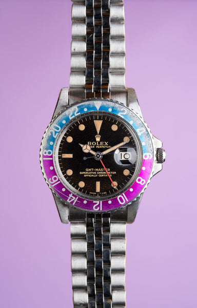 1965 Rolex Gilt 1675 GMT with Fuchsia turning Tropical