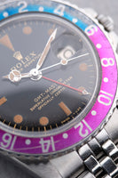 1965 Rolex Gilt 1675 GMT with Fuchsia turning Tropical
