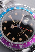 1965 Rolex Gilt 1675 GMT with Fuchsia turning Tropical