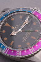 1965 Rolex Gilt 1675 GMT with Fuchsia turning Tropical